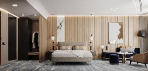 ドゥラスにあるCrowne Plaza Durres by IHGのベッドとテーブルと椅子のある寝室