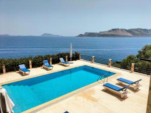 a swimming pool with a view of the ocean at Villa Escalade III in Kas