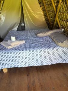 a mattress in a tent with a cup on it at Cabañas Green Life, Huasca de Ocampo in Huasca de Ocampo +20 photos