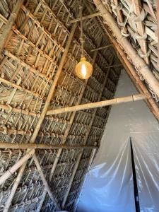 a ceiling of a building with a light on it at Cabañas Green Life, Huasca de Ocampo in Huasca de Ocampo
