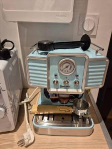 a coffee maker sitting on top of a counter at Le rock n roll cosy et tout équipé en hyper centre in Montbéliard