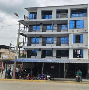 a large building with motorcycles parked in front of it at Rent Smart Palmira - Tranquilidad y Comfort in La Italia