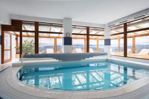 a pool in a house with a view at Rezidence & Wellness Blatov in Prague