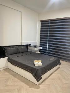 Ένα ή περισσότερα κρεβάτια σε δωμάτιο στο vinhome grand park +2 φωτογραφίες