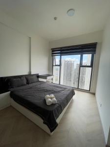 Ένα ή περισσότερα κρεβάτια σε δωμάτιο στο vinhome grand park