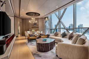a living room with a couch and a table at Crowne Plaza Shanghai Snow World by IHG in Shanghai