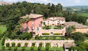 an aerial view of a large mansion with trees at Villa Piediprato in Spinetoli
