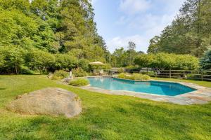a swimming pool in the middle of a yard at Bedford Retreat 15 Mi to Long Island Sound in Bedford