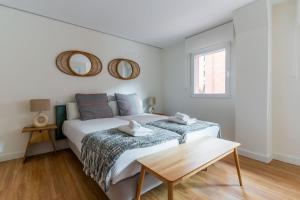 Postel nebo postele na pokoji v ubytování Cozy apartment- 1Bd 1Bth- Plaza Castilla