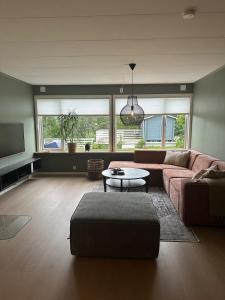 Posezení v ubytování Treroms leilighet på Lunheim