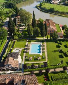 an aerial view of a house with a swimming pool at Villa La Massa in Bagno a Ripoli
