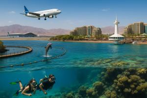two people swimming in the water with a whale in the ocean at Emanuel Suite in Eilat