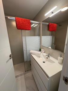 a bathroom with a sink and a mirror at Marys Place in Costa Del Silencio