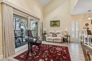 a living room with a couch and a table at Birdies Rest in Little River