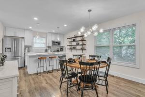 a kitchen with a table and chairs in a kitchen at Heaven's Crown by Granger Gardens in Ann Arbor