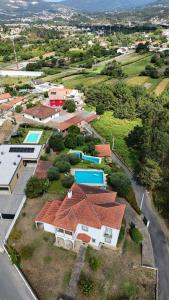 an aerial view of a group of houses andyards at Casa Maria Joana in Ponte de Lima