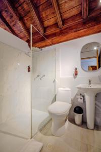 a bathroom with a toilet and a sink at La Dominica Hotel Boutique in Cartagena de Indias