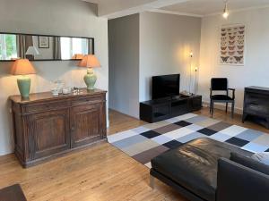 Posezení v ubytování Appartement 1er étage dans maison de maître