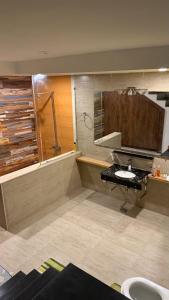 a bathroom with a sink and a shower at RBS Cottage in Murree