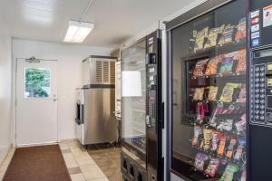 a kitchen with a refrigerator with food in it at Motel 6-Kelso, WA - Mt. St. Helens in Kelso