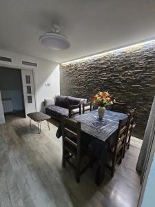 a living room with a table and a couch at El Cierzo de Sediles in Sediles