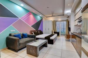 a living room with a couch and a table at HOTEL O ZOOM LUXURY STAY in Lonavala