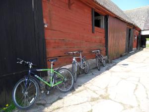 two bikes parked next to a red building at Mellby Ör Inn in Mellby