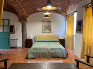 a bedroom with a bed in a large room at Casa Biloba in Valdengo +23 photos