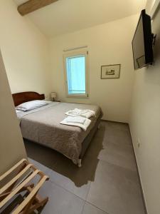 a bedroom with a bed and a television in it at Agriturismo "La Fondazza" in Imola +54 photos