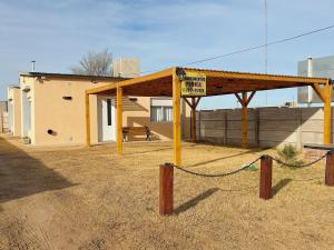 a pavilion with a sign in front of a building at Sitios del Sol 1 in General Acha