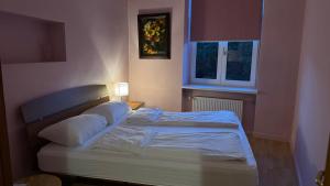 a bedroom with two beds and a window at BestHomeRiga in Rīga