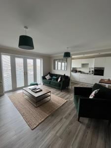 a living room with a couch and a coffee table at Hartlepool Marina View Apartment in Hartlepool