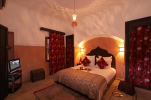Postelja oz. postelje v sobi nastanitve Riad Nesma Suites & Spa
