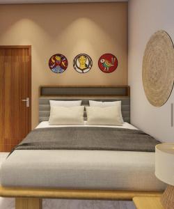 a bedroom with a bed and some stickers on the wall at a28 ORANGE BRICKS in Kolkata
