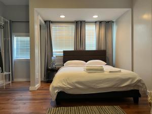 Ένα ή περισσότερα κρεβάτια σε δωμάτιο στο Stay with Jay - Quinta Suite