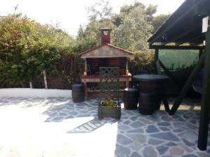 a small bird house sitting on a patio at Dasea Houses in Ormos Panagias