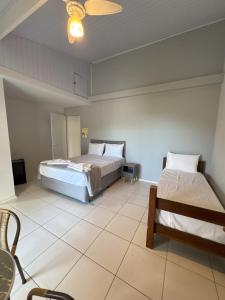 Postel nebo postele na pokoji v ubytování Pousada Vila Coral