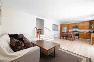 a living room with a couch and a table at Central Spacious in San Diego +24 photos