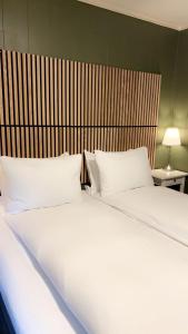 Ένα ή περισσότερα κρεβάτια σε δωμάτιο στο Private Room in Cozy Home - Les Homes