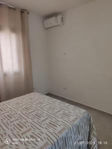 a bedroom with a bed with a white bedspread at Villa Mirador de la Loma in Pájara +7 photos
