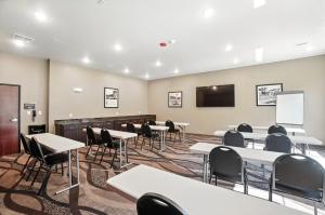 a classroom with tables and chairs and a screen at Cobblestone Hotel & Suites - Bellefontaine in Bellefontaine +113 photos