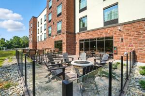 a patio in front of a brick building at Cobblestone Hotel & Suites - Bellefontaine in Bellefontaine +111 photos