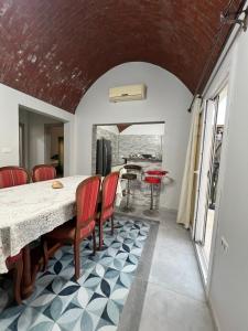a kitchen and dining room with a table and chairs at Poraa roof in Hurghada