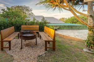 a table and two chairs and a table and a bench at Casas Valley Design - Praia do Rosa/SC in Praia do Rosa +68 photos