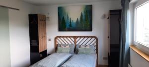 Ένα ή περισσότερα κρεβάτια σε δωμάτιο στο Schwarzwaldstübchen "Gran Vista" mit Schwimmbad +24 φωτογραφίες