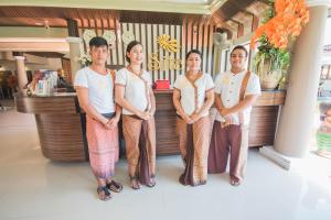 a group of people standing in front of a counter at Sita Beach Resort in Ko Lipe +37 photos