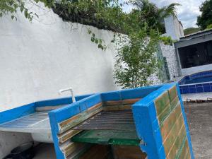a blue bench with a water faucet next to a building at Honda-Tolima in Honda