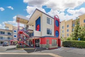 a building with a playground in a parking lot at Best Western Courtesy Hotel - Anaheim Resort Amusement Park in Anaheim