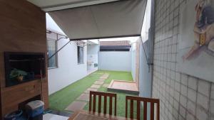an internal view of a room with green grass at Condomínio Lion Ville in Benjamim
