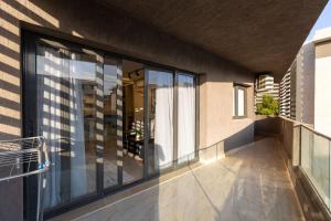 a balcony of a house with glass windows at B15/87/31 · 3BR Haven in B15 Madinaty in Madinaty